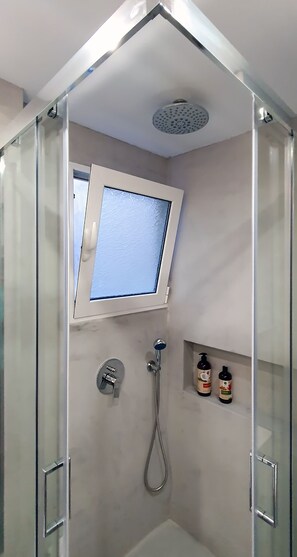 Shower, hair dryer, towels, soap