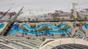 A resort with a large pool area, a beach, and a boardwalk. - Phoenix West 1606 3 Bedroom Condo (Orange Beach)