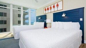 A hotel room with two beds, a ceiling fan, a large window with a view, and a wall-mounted artwork. - Phoenix Orange Beach Ii 405 4 Bedroom Condo (Orange Beach)