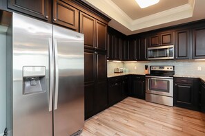 Condo, 3 Bedrooms | Private kitchen | Fridge, oven, coffee/tea maker
