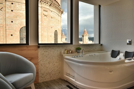 Superior Suite | Desk, laptop workspace, blackout drapes, iron/ironing board. Vaway Hotel
