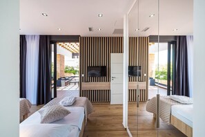 4 bedrooms, premium bedding, iron/ironing board, WiFi