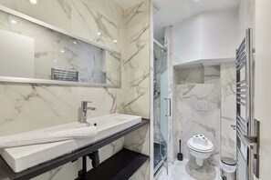 Shower, hair dryer, towels, soap