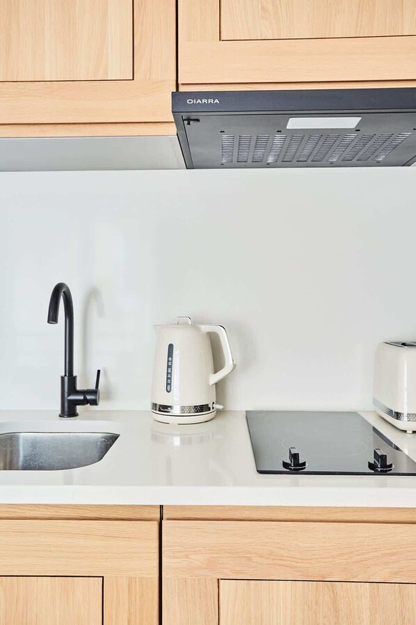 Fridge, microwave, stovetop, coffee/tea maker