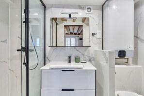 Shower, hair dryer, towels, soap