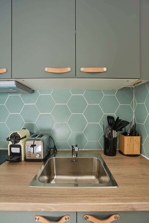 Fridge, microwave, stovetop, coffee/tea maker