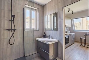 Shower, hair dryer, towels, soap