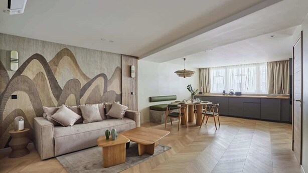 A modern living room with a sofa, coffee table, and a dining area with a table and chairs. - Spacious AC flat Luxembourg St Germain des près (Paris)