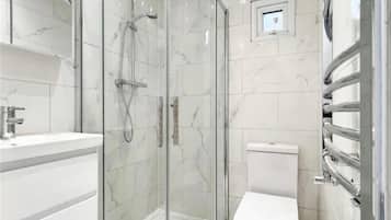 Shower, hair dryer, towels, toilet paper