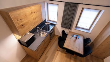 Gallery Apartment | Living area | 42-inch Smart TV with cable channels, heated floors