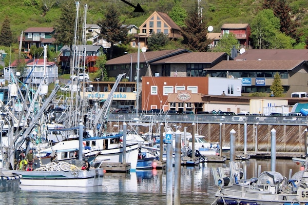 The view of the house from the main harbor in town. Charming A-framed house.