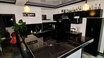 Full-sized fridge, microwave, stovetop, rice cooker