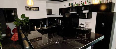 Full-size fridge, microwave, stovetop, rice cooker