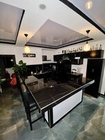 Full-size fridge, microwave, stovetop, rice cooker