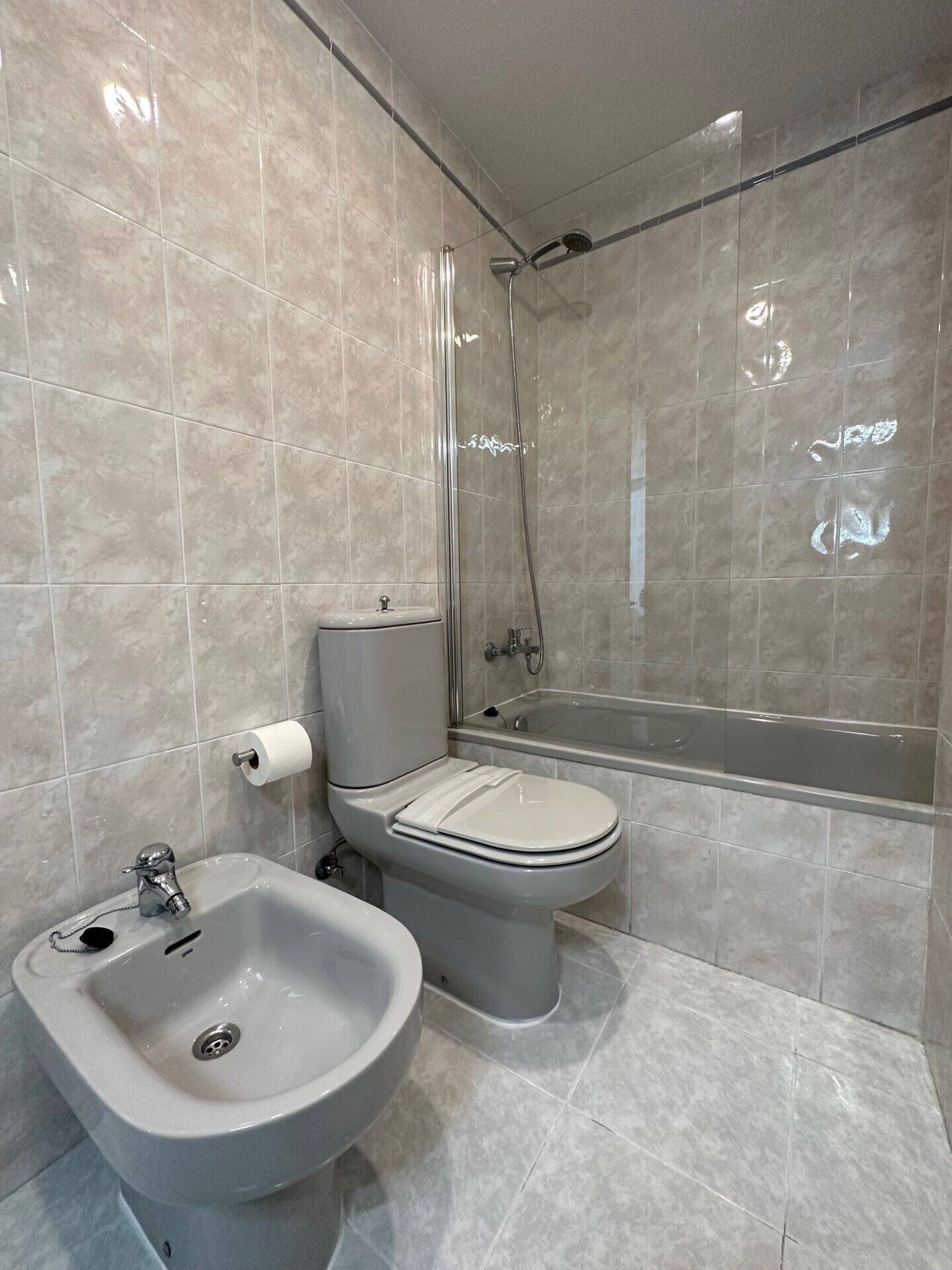 Bathtub, hair dryer, towels