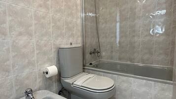 Bathtub, hair dryer, towels