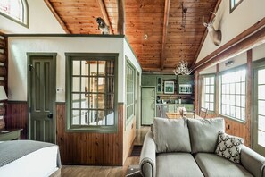 Relax in this inviting space with a comfortable sofa and shared dining area.