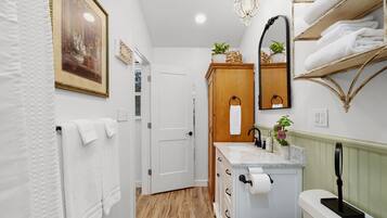 Bathtub, hair dryer, towels, soap