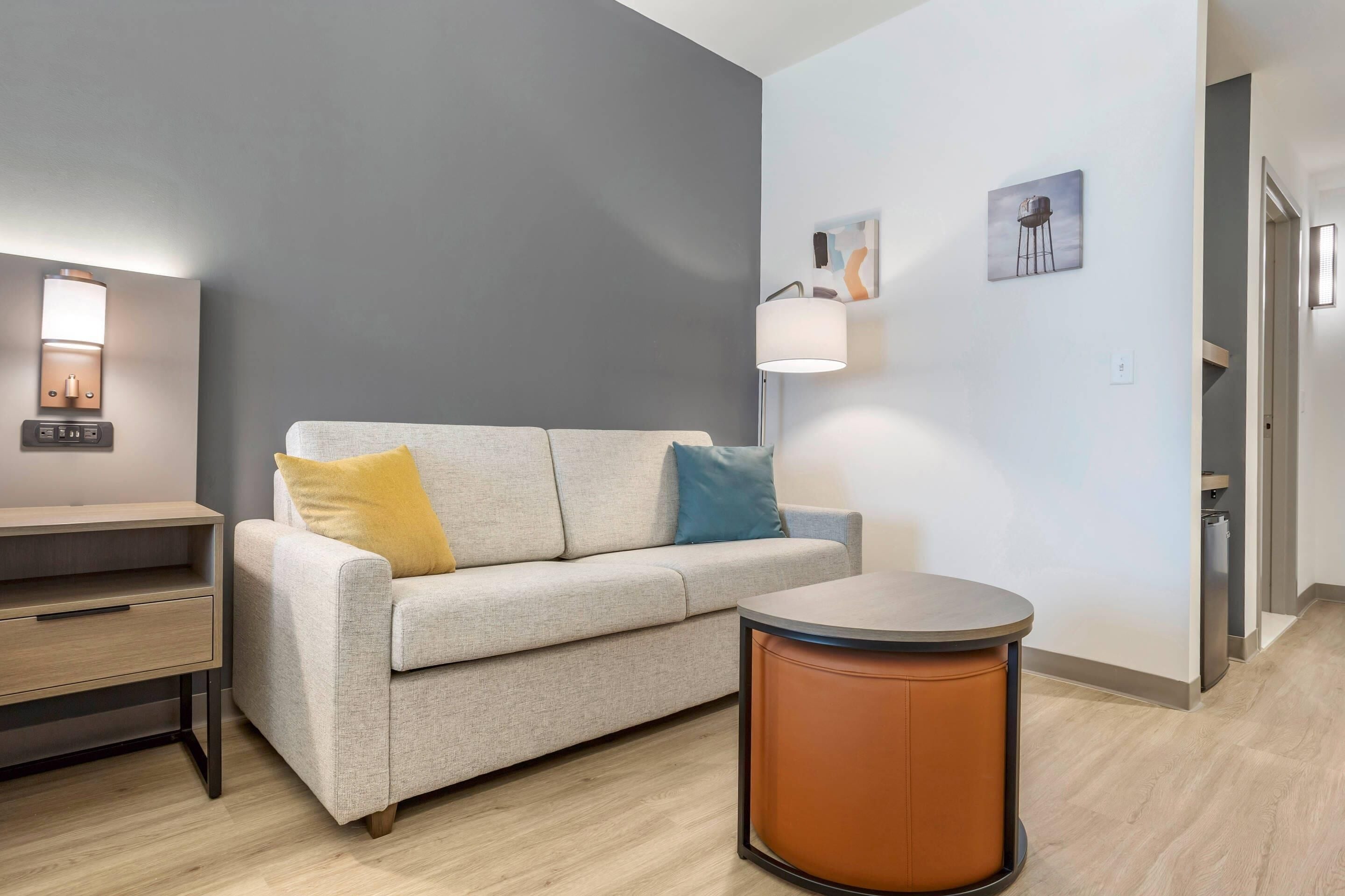 Premium bedding, desk, laptop workspace, blackout drapes