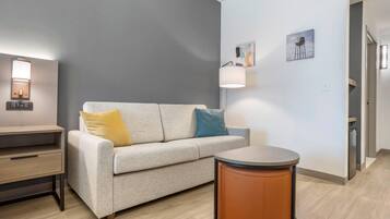 Premium bedding, desk, laptop workspace, blackout drapes