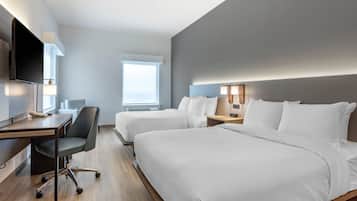 Premium bedding, desk, laptop workspace, blackout drapes