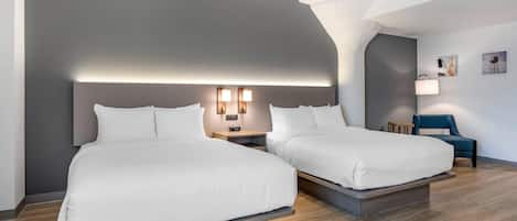 Premium bedding, desk, laptop workspace, blackout drapes