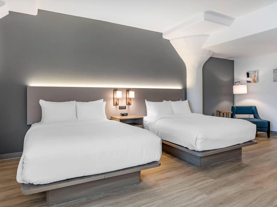 Premium bedding, desk, laptop workspace, blackout curtains