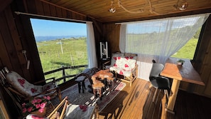 Honeymoon Chalet, Jetted Tub, Mountain View | Living area | 32-inch TV with digital channels