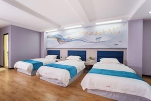 A hotel room with three beds, each with white bedding and blue accents. The room has a wooden floor, a large mural on the wall depicting a serene landscape, and a modern ceiling design with recessed lighting. - Xian Biao Business Hotel (Wuping)