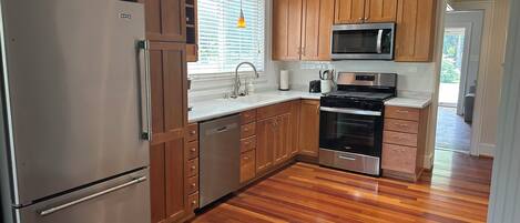 Fridge, microwave, oven, cookware/dishes/utensils