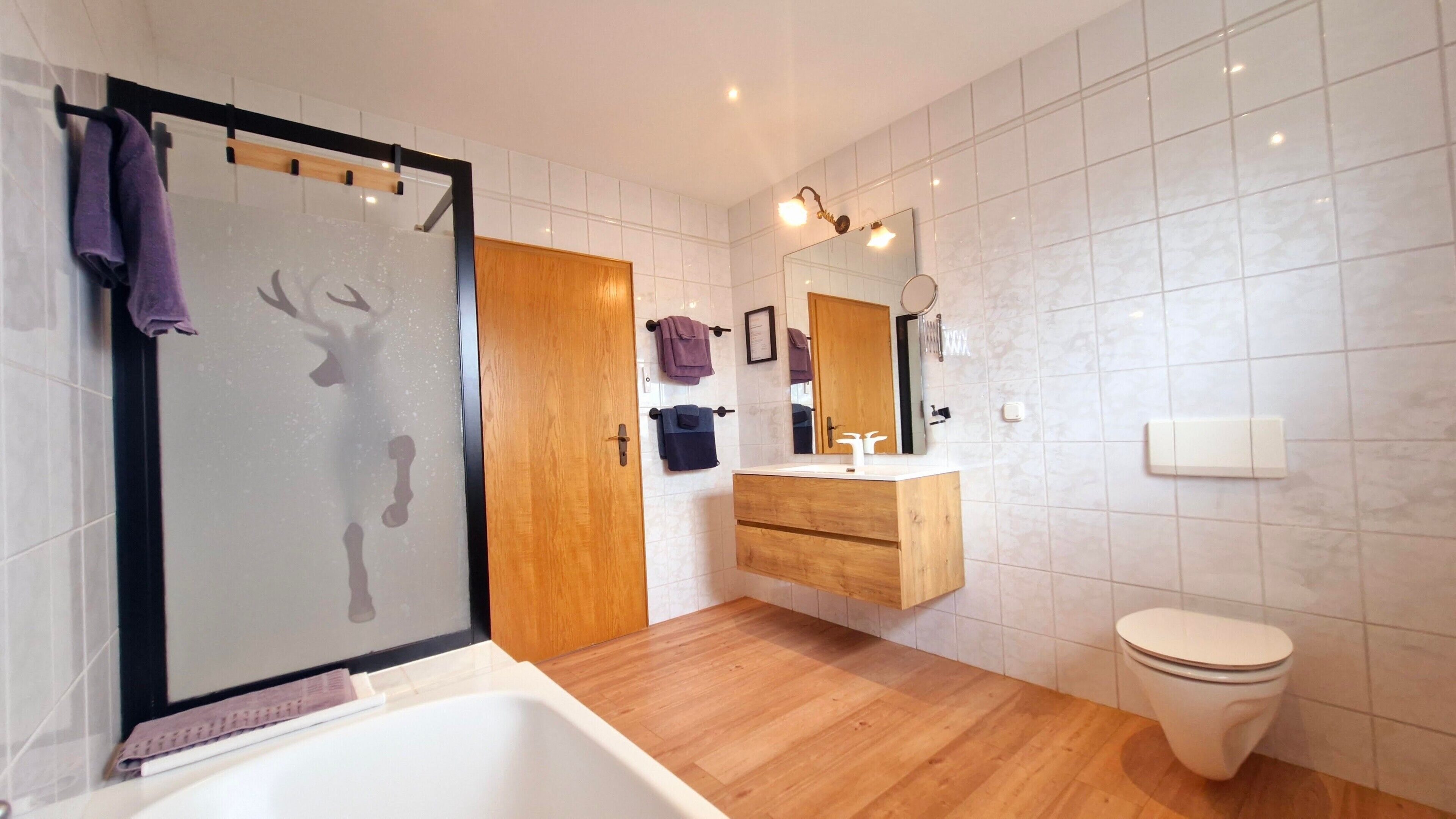 Bathtub, hair dryer, towels