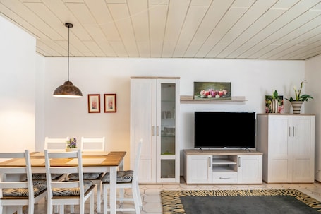 Dining. Holiday Home 'Am Twistesee 1 Souterrain' with Terrace, Garden & Wi-Fi