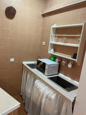 Fridge, microwave, coffee/tea maker, toaster