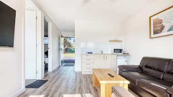 Quarto triplo luxo | Área de estar