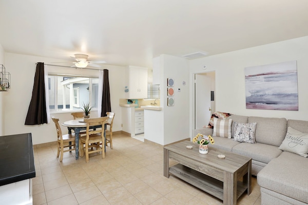 The living room area has a sofa that converts into a full bed for guest comfort!