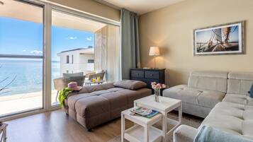 Family Apartment, Multiple Bedrooms, Lakeside (Lake Side Luxury-Steps To The Lake) | Living area | 21-inch TV with cable channels