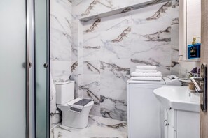 Shower, free toiletries, hair dryer, towels