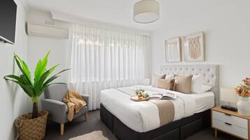 1 bedroom, desk, iron/ironing board, travel cot