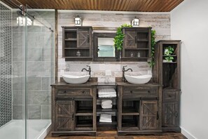 Bathtub, hair dryer, towels, toilet paper
