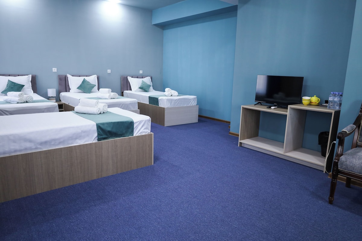 Standard Quadruple Room | Laptop workspace, blackout curtains, iron/ironing board (on request)