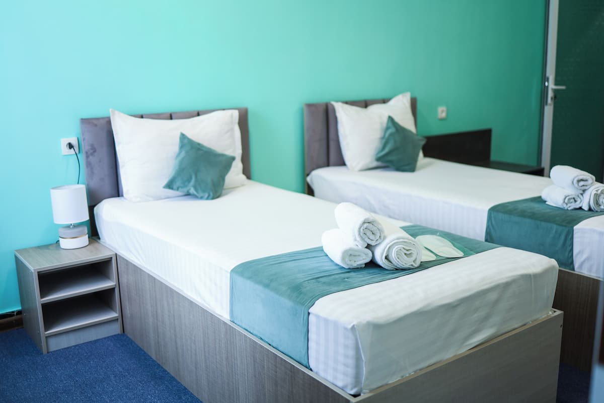 Standard Twin Room, 2 Single Beds | Laptop workspace, blackout curtains, iron/ironing board (on request)