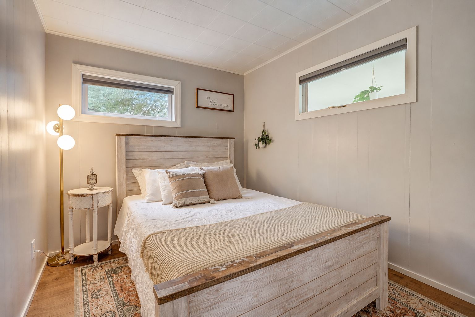 Bedroom 1 - Peaceful queen bedroom with soft linens, designed for a restful night after lake days and outdoor adventures.
