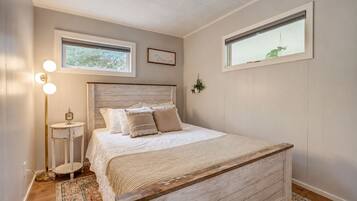 Bedroom 1 - Peaceful queen bedroom with soft linens, designed for a restful night after lake days and outdoor adventures.
