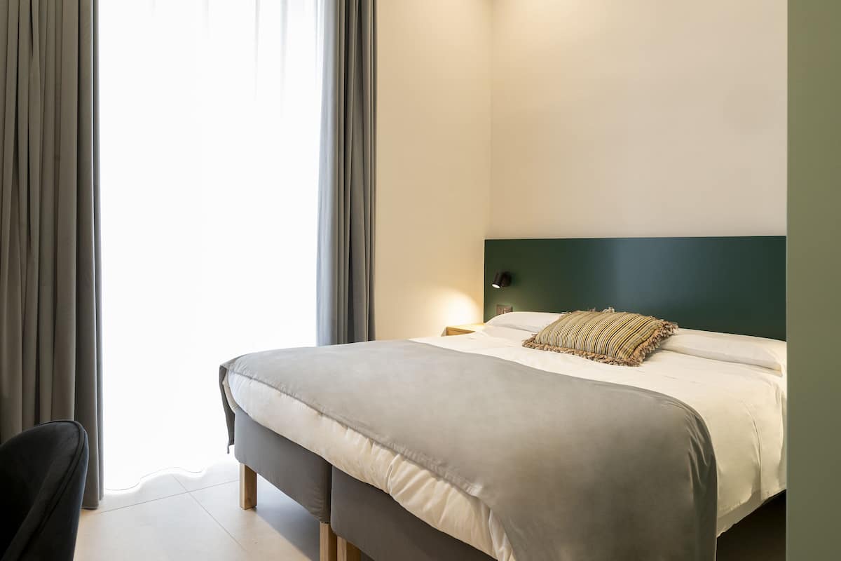 Premium bedding, down comforters, memory foam beds, minibar