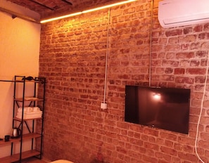 Relax in this cozy space with a flat-screen TV and convenient storage for your essentials.