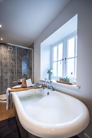 Bathtub, hair dryer, towels