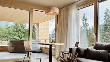 Luxury Condo, 2 Bedrooms, Hot Tub, Mountainside | Living area | Smart TV, Netflix, toys, heated floors