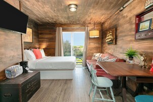 Design Studio Suite | Desk, laptop workspace, blackout drapes, bed sheets