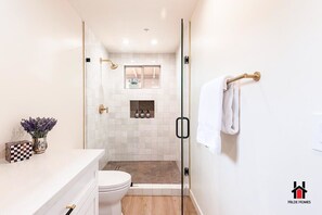 Shower, hair dryer, towels, soap