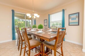 Enjoy meals with family and friends at the dining table, surrounded by natural light and a beautiful view.